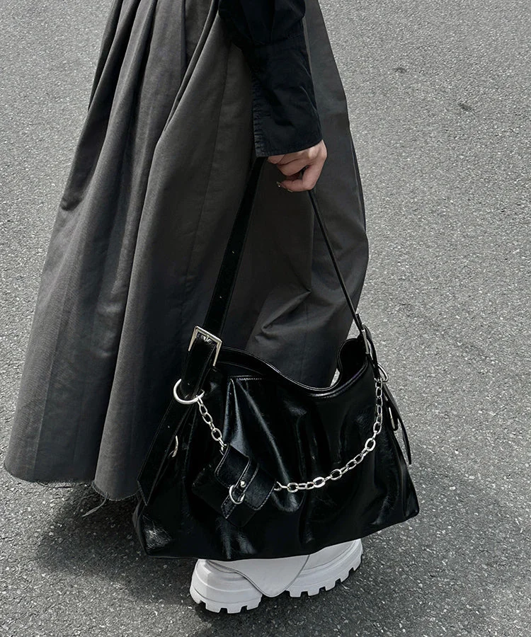 Unique black patchwork faux leather crossbody bag.