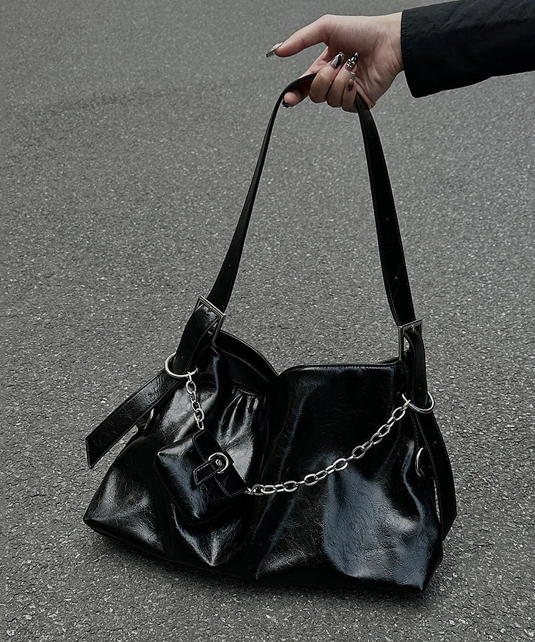 Unique black patchwork faux leather crossbody bag.