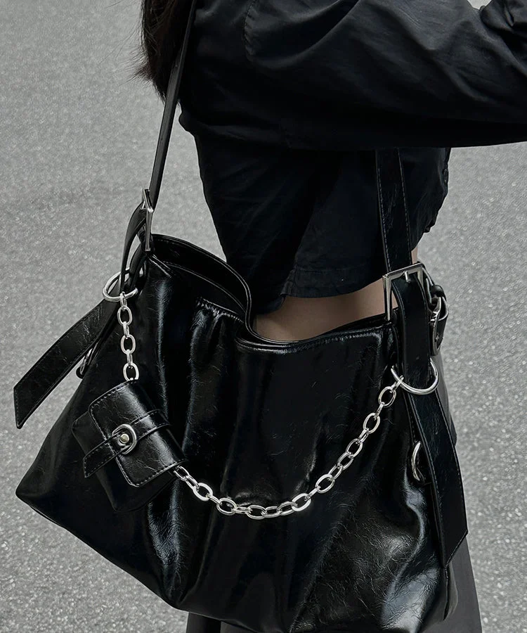 Unique black patchwork faux leather crossbody bag.
