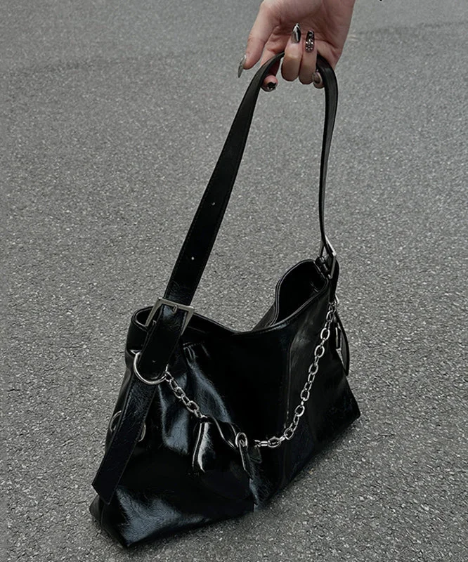Unique black patchwork faux leather crossbody bag.